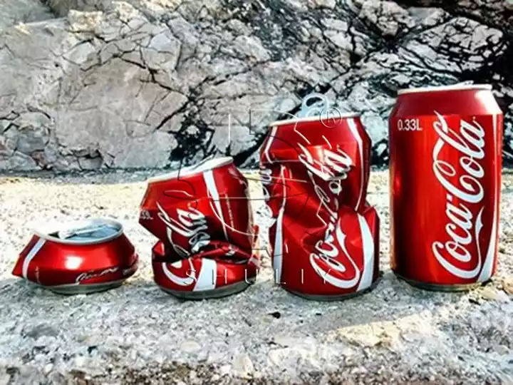comparison of flattened and original aluminum soda cans